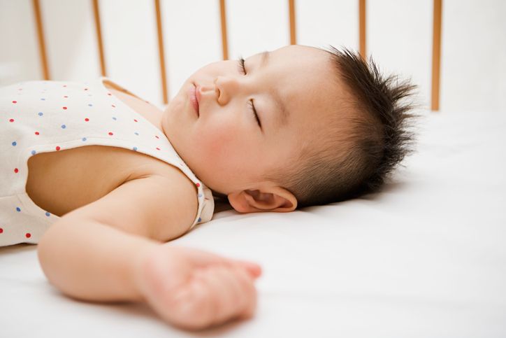 Baby lying in crib